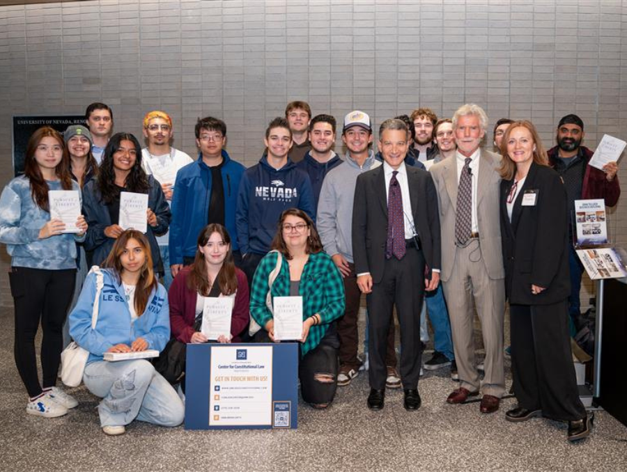 A crowd of people sitting in a lecture hall.