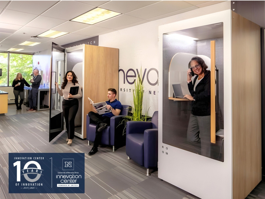 Several professionals working in UNR's Innovation Center's co-working space, including two soundproof office phone booths. A banner celebrates "10 Years of Innovation."
