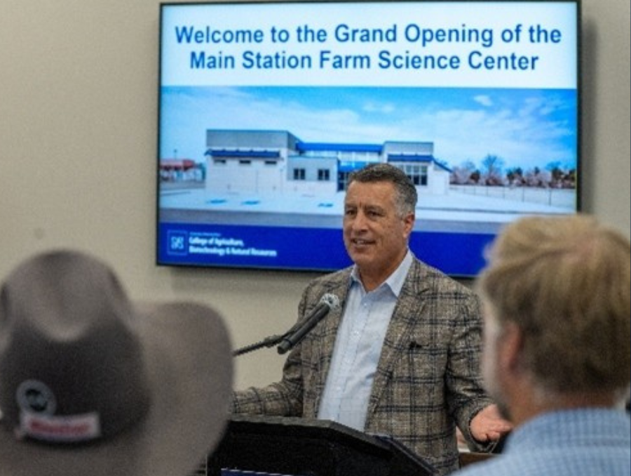 A man addressing people in a room.