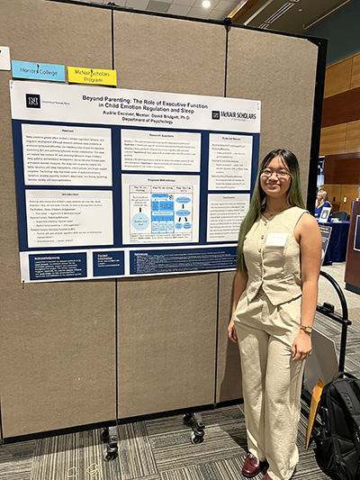 Wolf Pack Discoveries Pictures: Audrie Escover presenting at the Wolf Pack Discoveries research symposium in Summer 2025