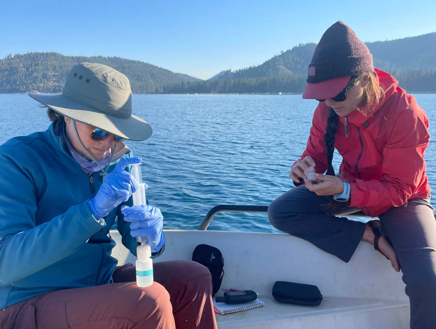 Dr. Loria and her colleague sort through samples on the research boat.