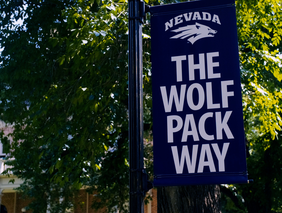 The Wolf Pack Way banner sign which has the Nevada Sport Wolf logo at the top.