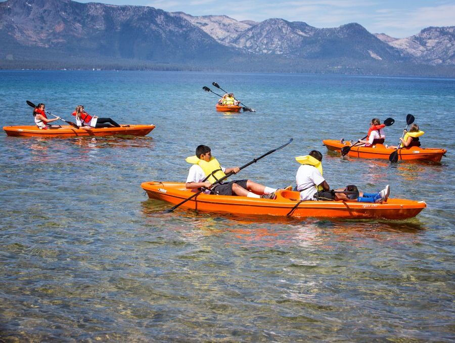 Youth kayakers in Lake Tahoe.