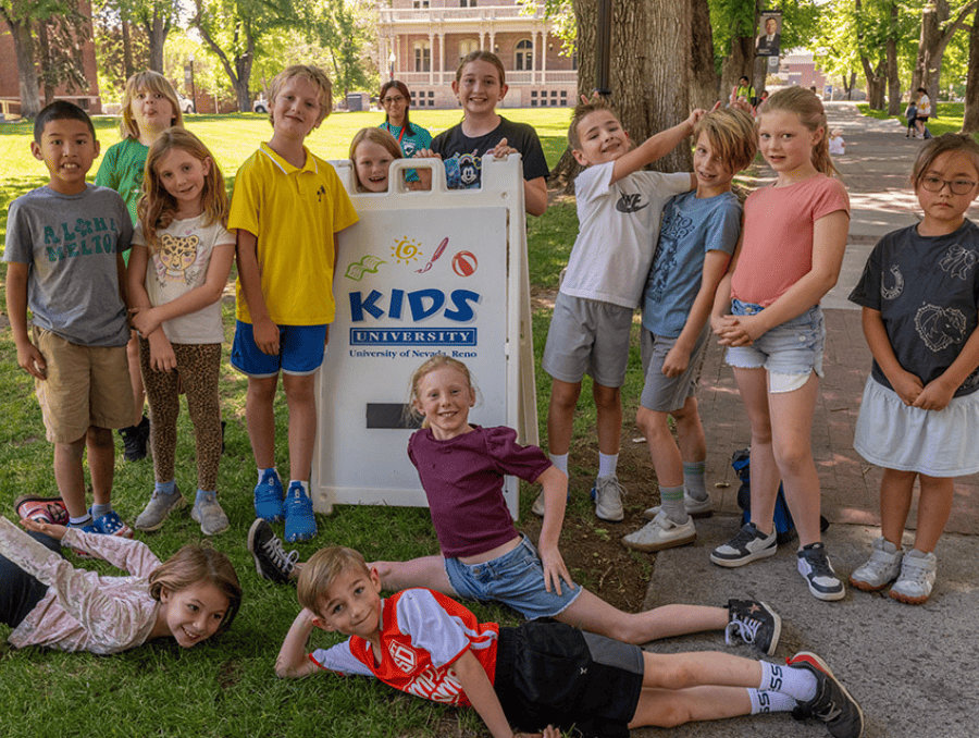 A group of children standing together for a photo.