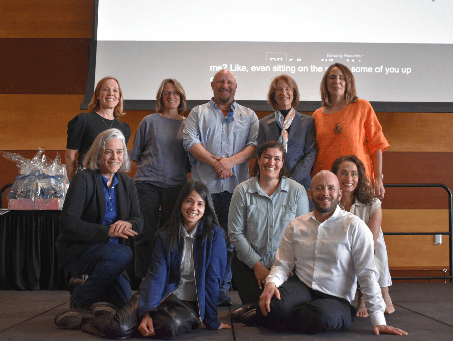 Dean Isabelli on stage with college unit leaders.