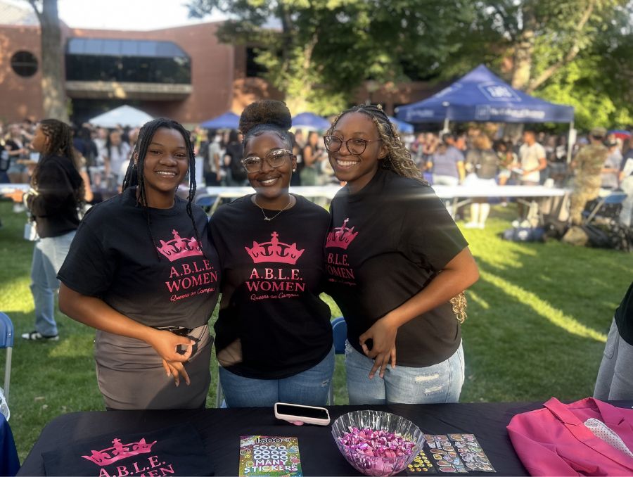 A.B.L.E. Women e-board members pose at their table during the ASUN Fall Club Fair in the Quad.