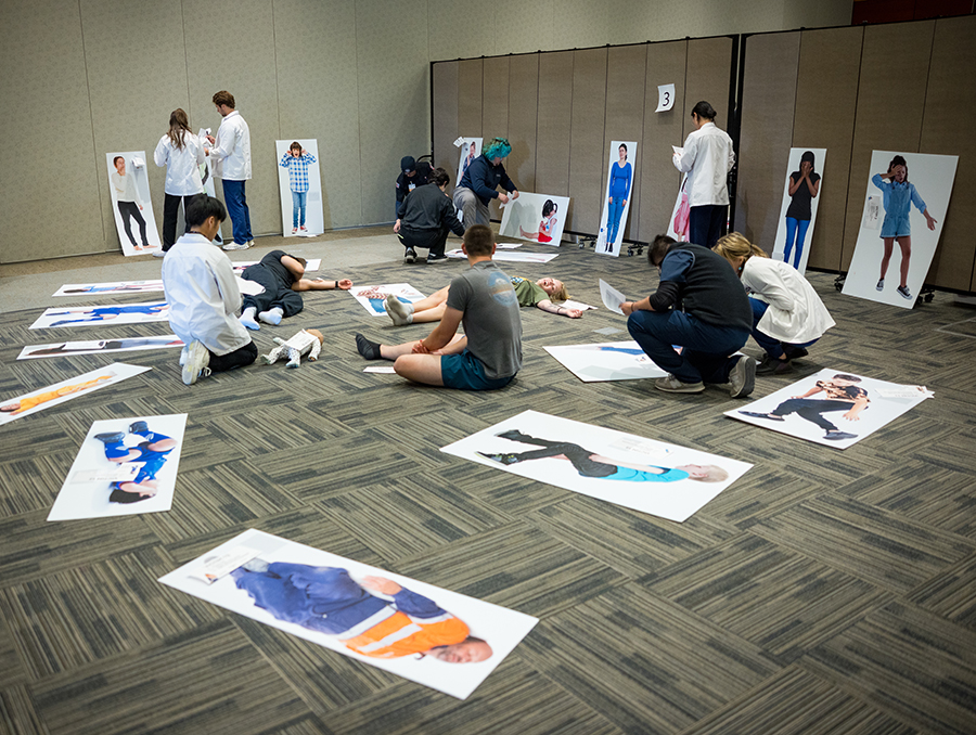 Students work together to triage patients in a simulated disaster response.