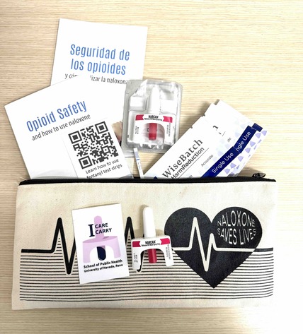 A naloxone test kit with test trips, naloxone and information pamphlets.
