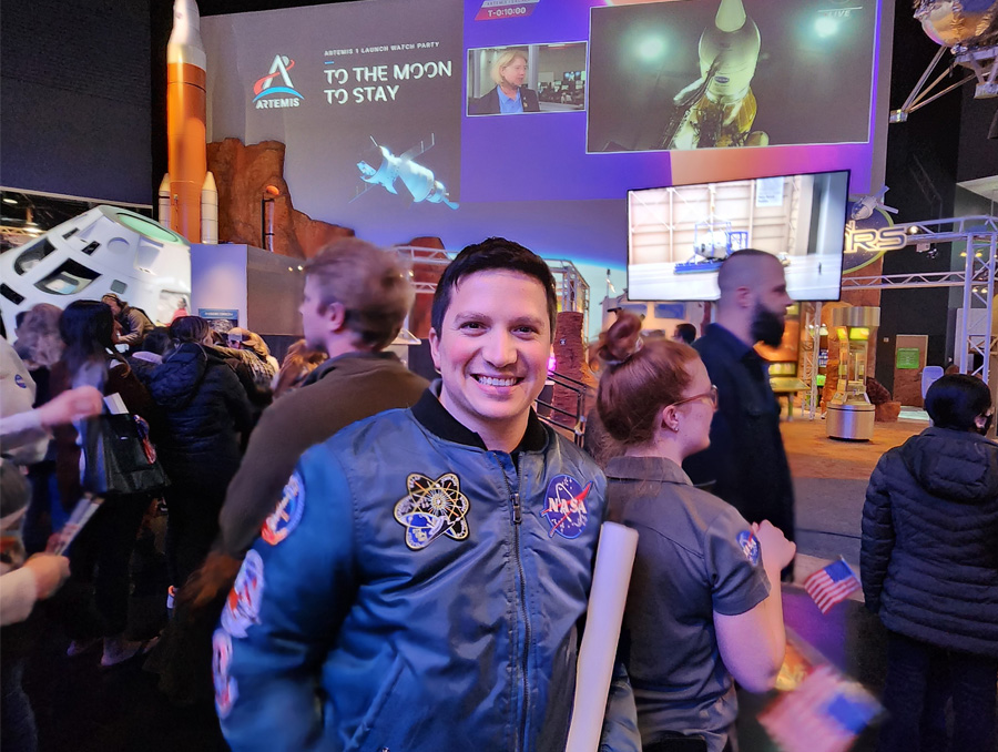 Retana, smiling in his NASA uniform, during an Artemis launch event.