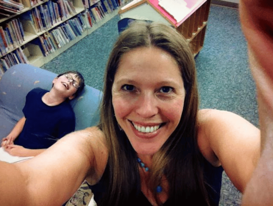 Mother and son, smiling into the camera.