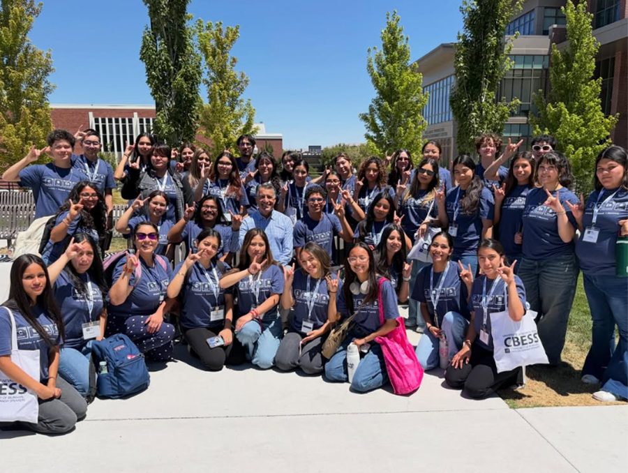 A group of CBESS students pose for a photo with Brian Sandoval on the University of Nevada, Reno campus.