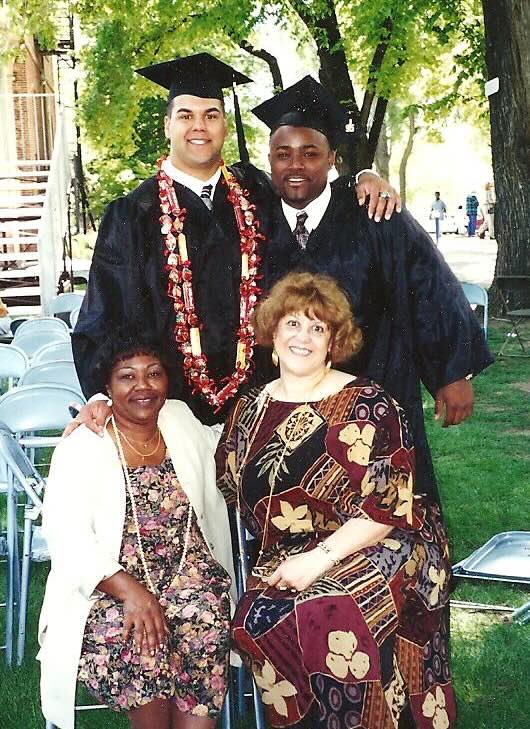 Jason Frierson and Anthony Valentin with their moms at graduation.