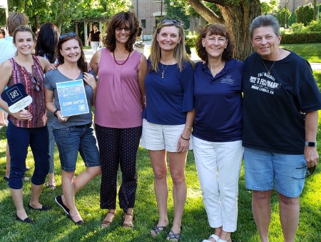 Marena Works surrounded by students, alumni and faculty at the Pack Picnic.