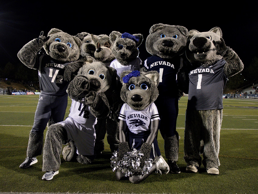 Nevada mascots posing on a football field.