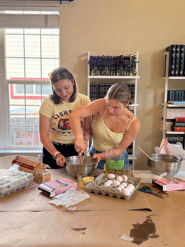 Two people baking cookies in a kitchen.