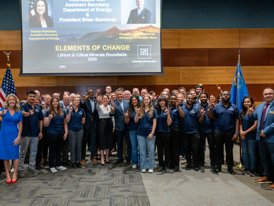 University leaders and government officials pose on University campus.