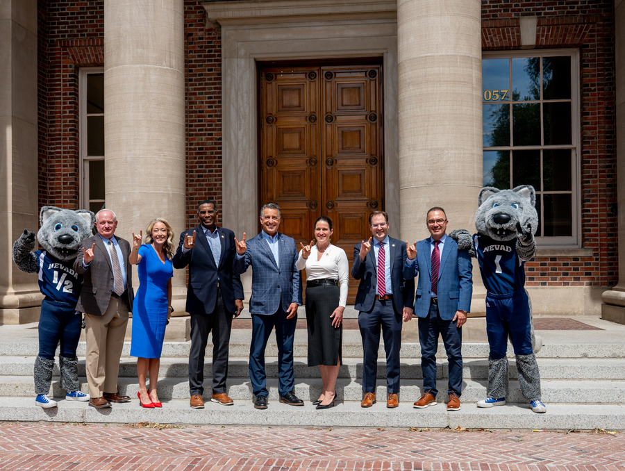 University and government leaders pose for a photo on campus.