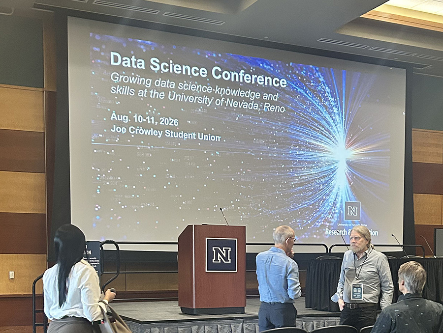 Data Science Conference presentation screen and people.