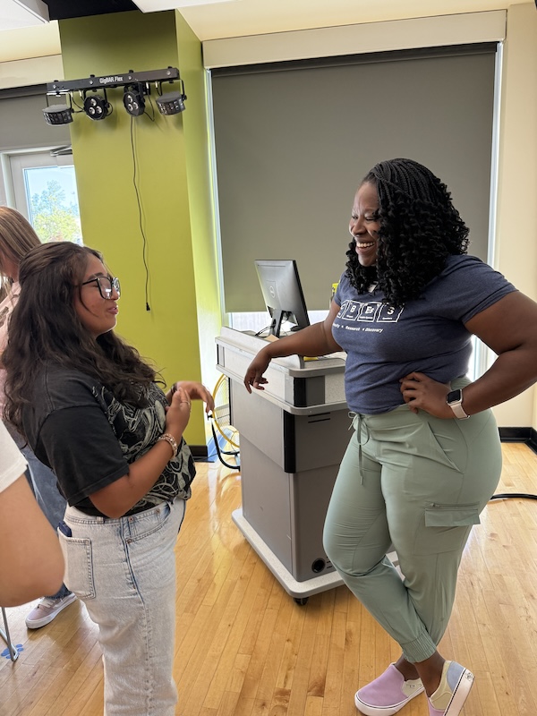 Harvey connects with a student after a presentation.