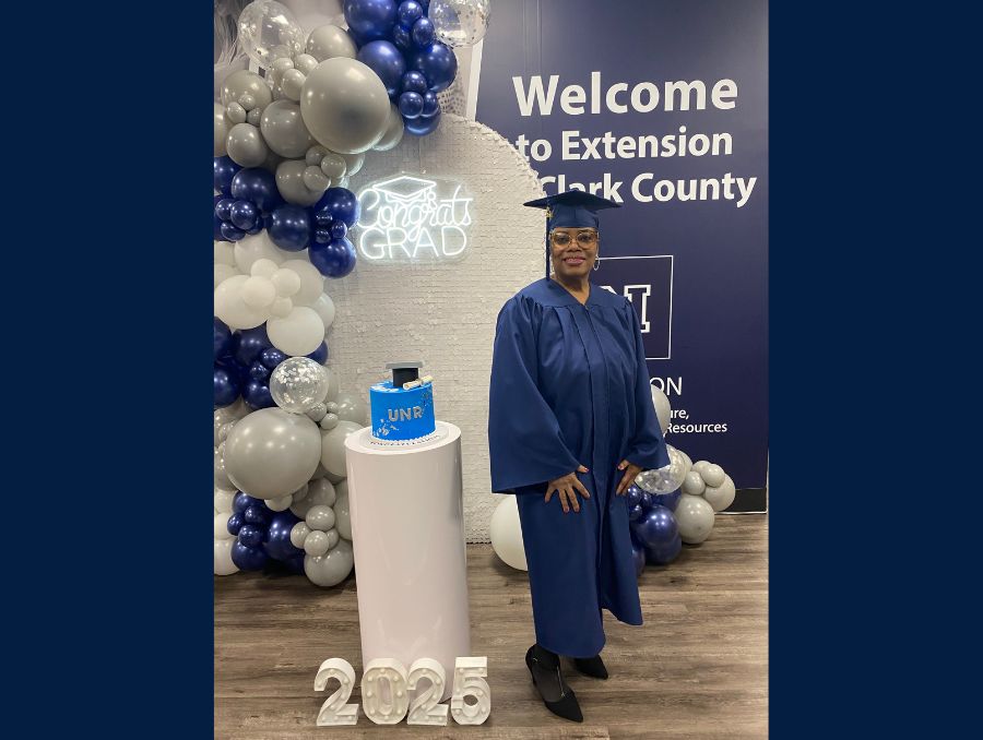 Lisa Davis posing for a photo on her graduation. 