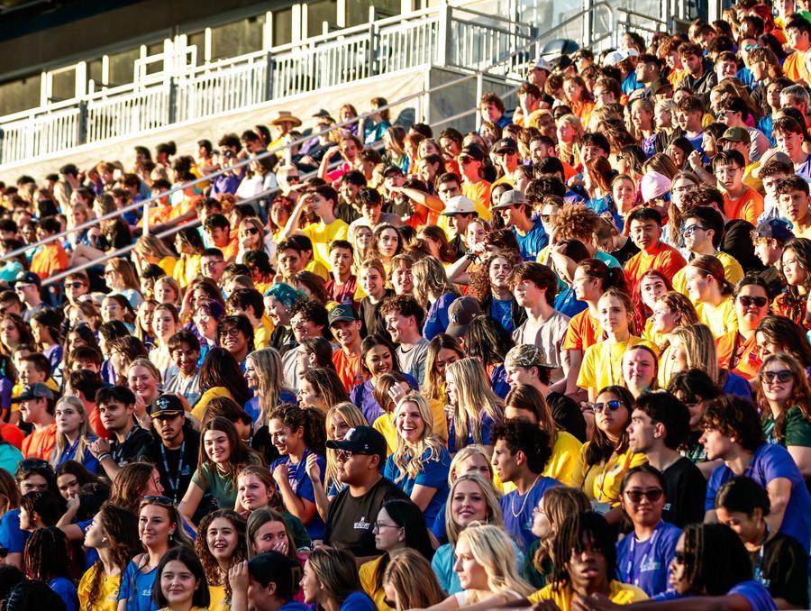 A stadium full of students in different colored NevadaFIT t-shirts.