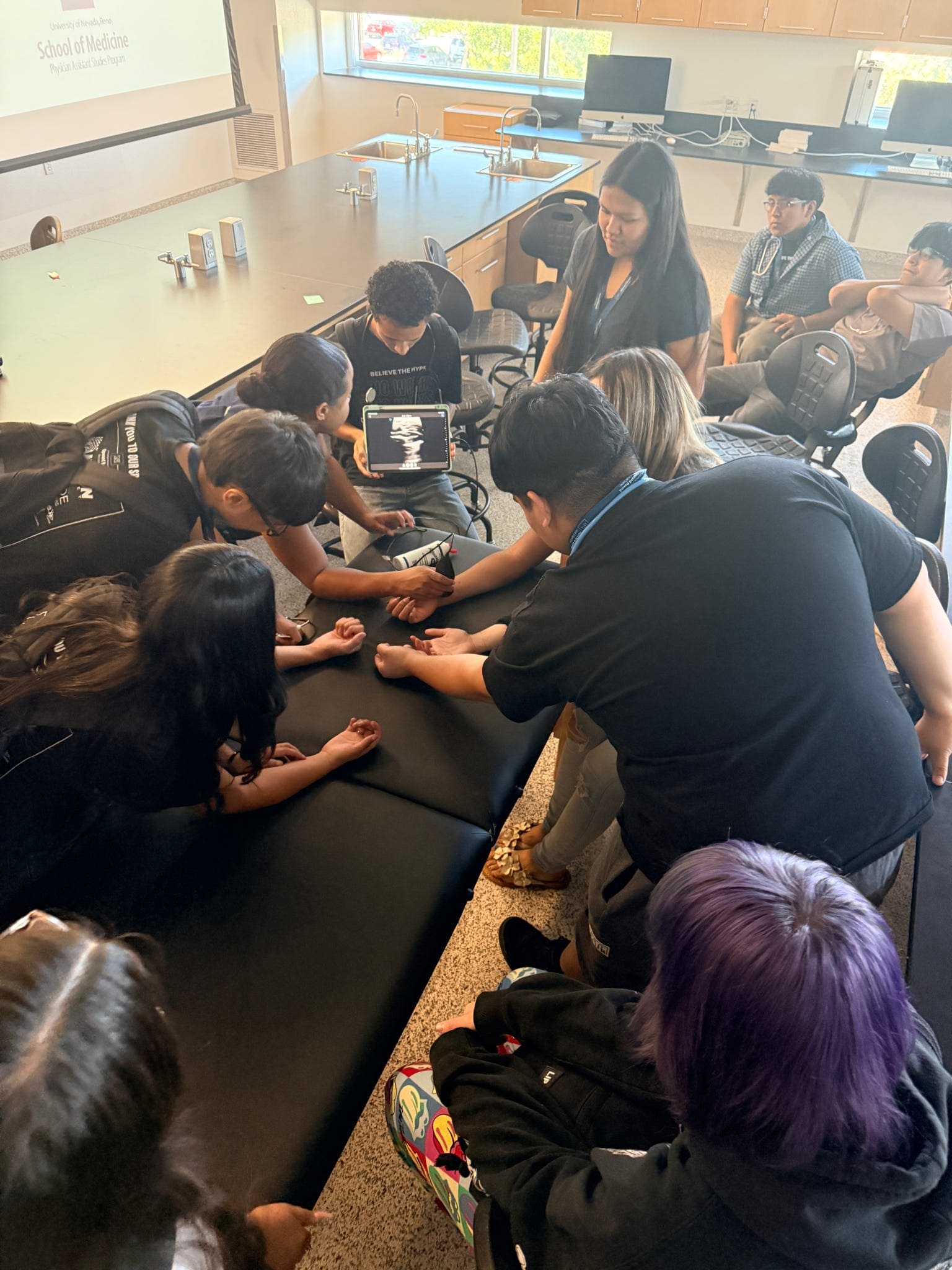 Students are using an ultrasound imaging machine.