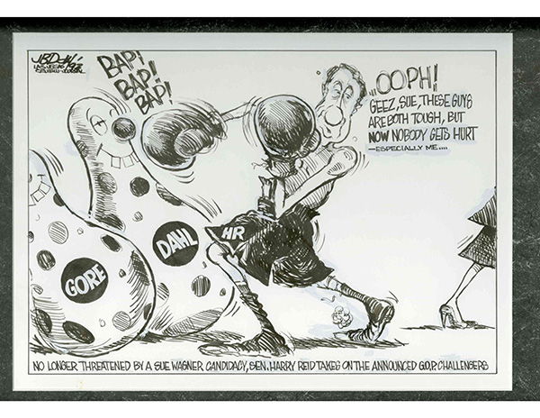 A black and white political cartoon from the Las Vegas Review Journal depicting Senator Harry Reid fighting GOP Challengers represented as boxing dummies. Text on the cartoon reads: "Bap! Bap! Bap! Ooph! Geez, Sue, these guys are both tough, but now nobody gets hurt - especially me&hellip; no longer threatened by a Sue Wagner candidacy, Sen. Harry Reid takes on the announced GOP challengers."