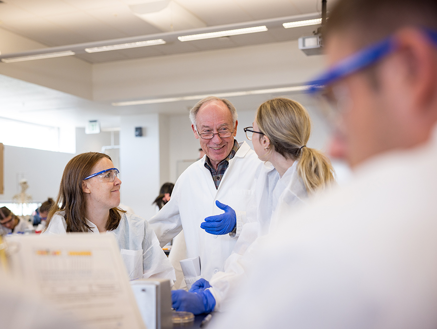 Kozel talking with medical students in a classroom.