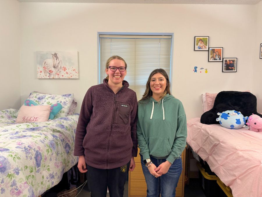 Ellie and Faye in the residential hall room.