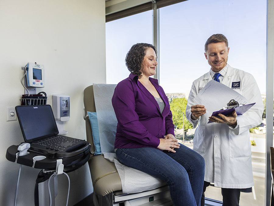 A physician talking with a patient in a clinic.