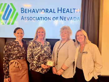 Nancy Roget with the CASAT staff at a ceremony.