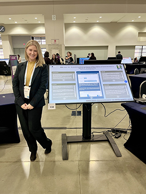 Nicole K. Tomitz, M.S., CCC-SLP, presenting research at the ASHA convention.