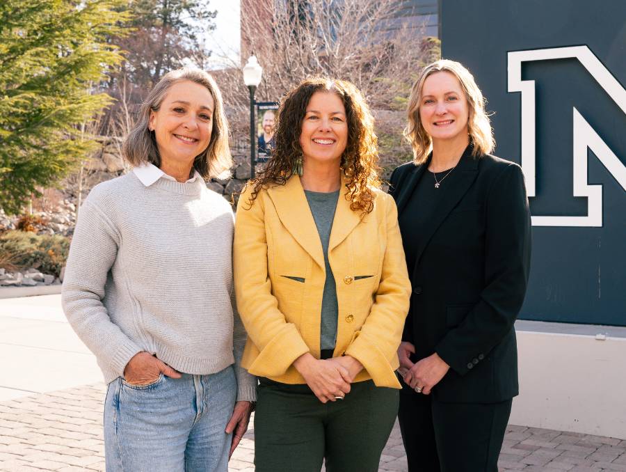 Cheryl Larson, Abbie Olszewski and Lindsay Diamond standing in front of the Nevada N.