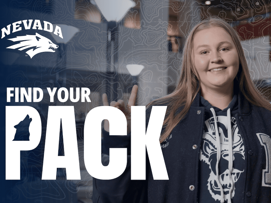 Screengrab from Mikayla's video featuring the Find Your Pack and Nevada Athletics logos. Mikayla smiles while wearing Nevada branded gear and holding her hand in a Wolf Pack hand sign.