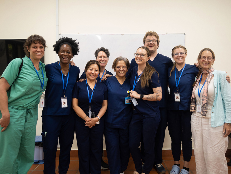 A group of people wearing scrubs.