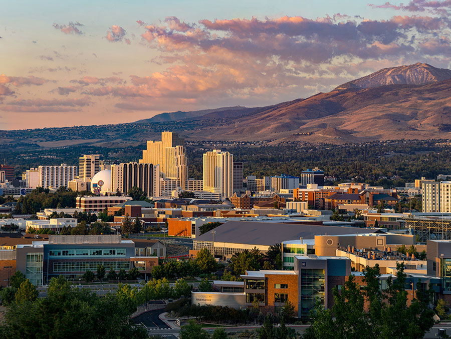 The University of Nevada, Reno campus and downtown Reno with the Sierra Nevada mountains in the skyline.