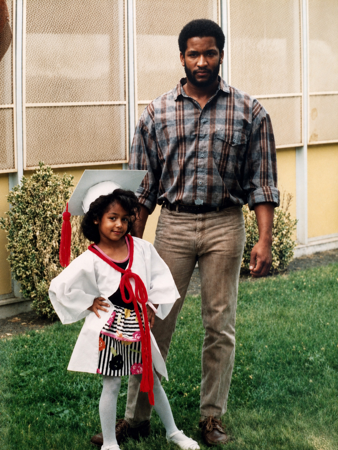 Six-year-old Dominique posing with her father. 