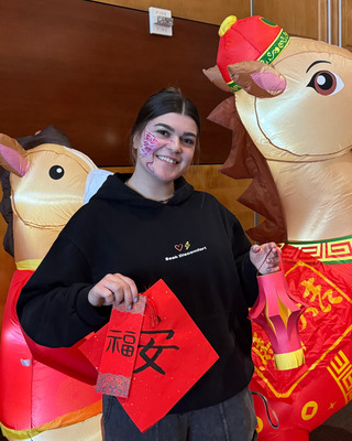 Kaden Ackerson poses at a Lunar New Year celebration. 