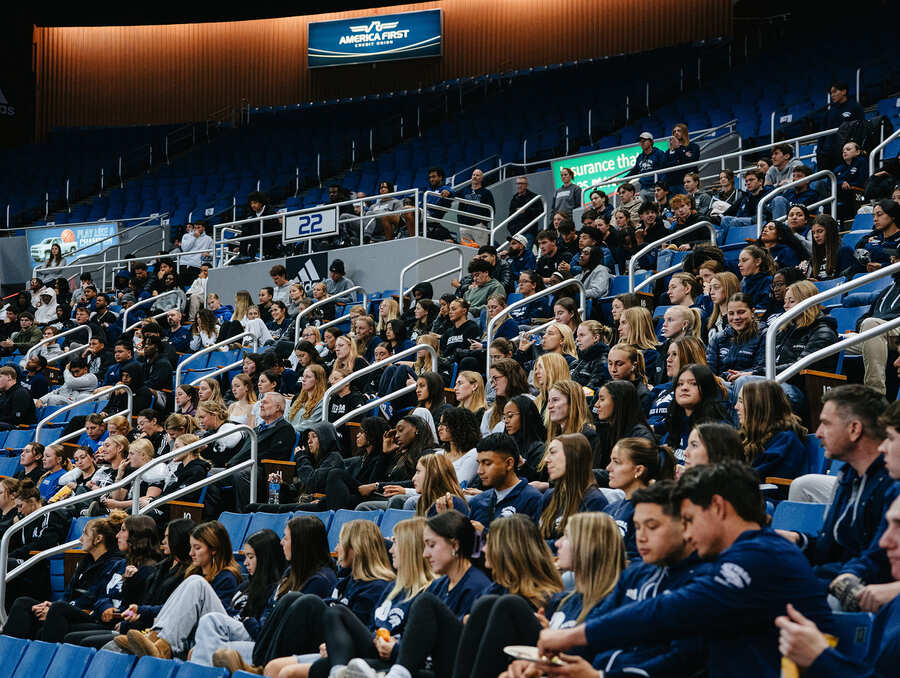 Student-athletes watching presentation at welcome back.