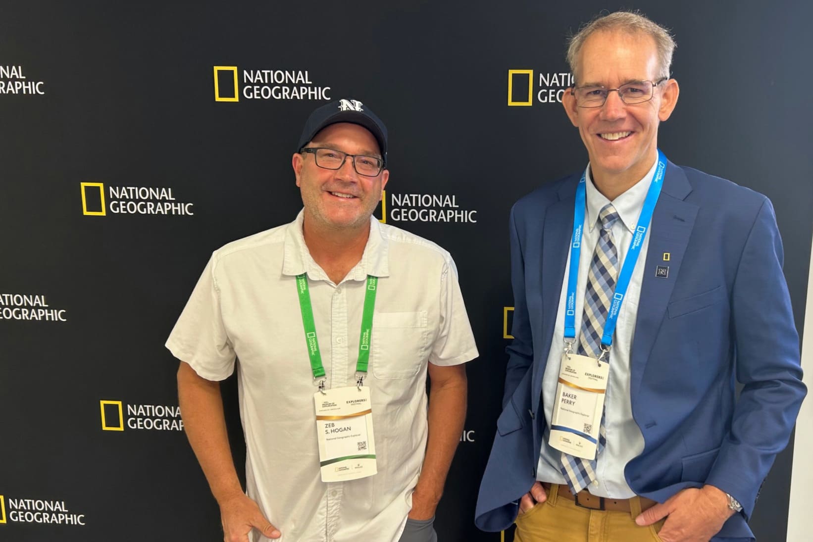Zeb Hogan and Baker Perry attend a National Geographic Museum opening.