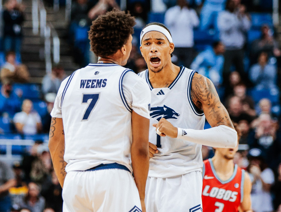 Nevada men's basketball players Vaughn Weems and Elijah Price celebrating.