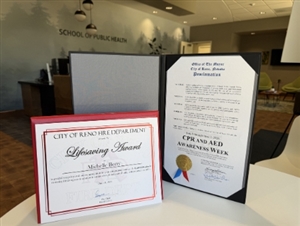 A life-saving certificate and proclamation given to CASAT team members from the City of Reno.
