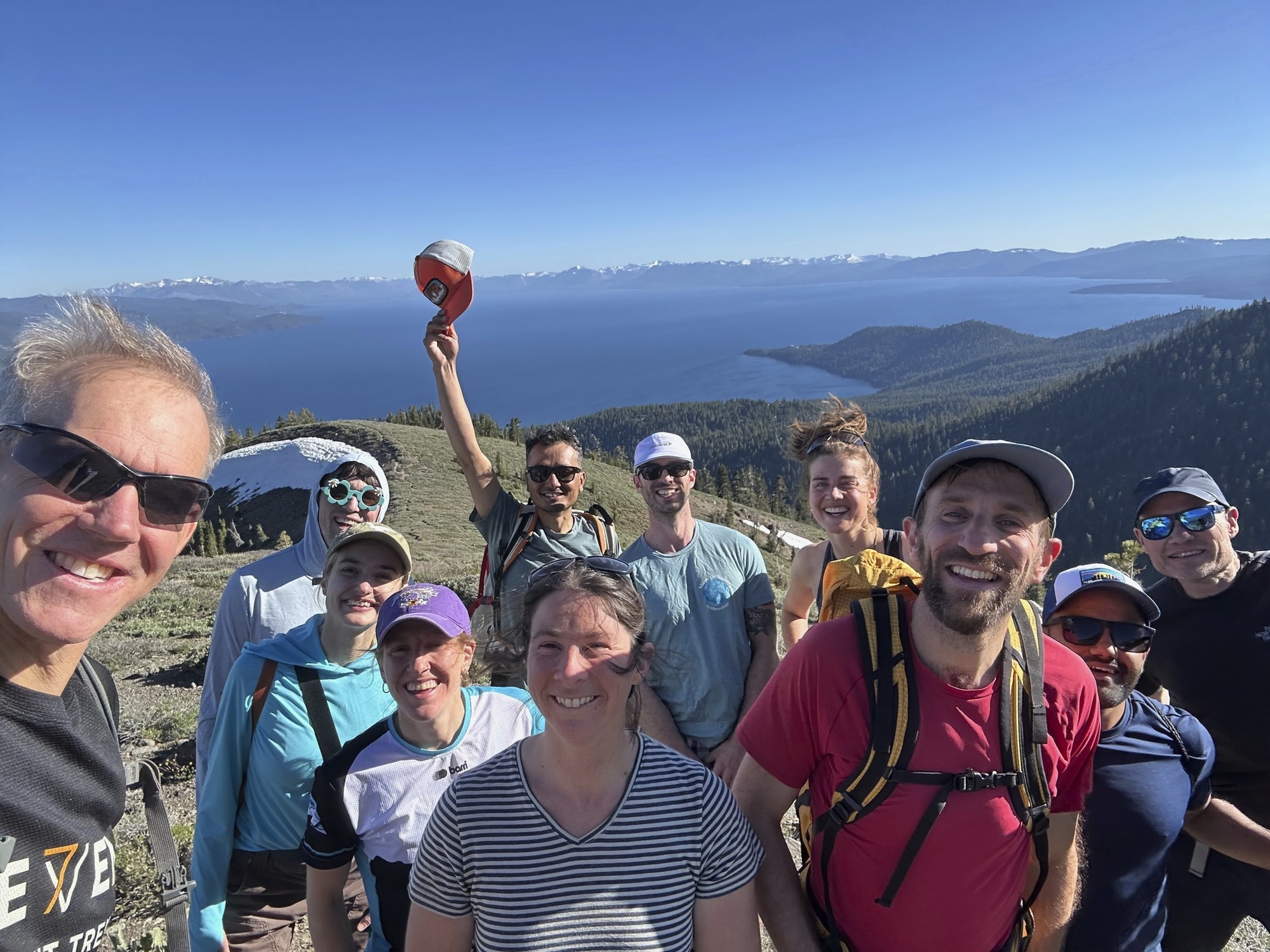 Group of researchers on a hike with Lake Tahoe in background. 