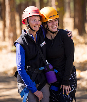 Angie DiPrinzio and Jessica Giron in climbing gear.