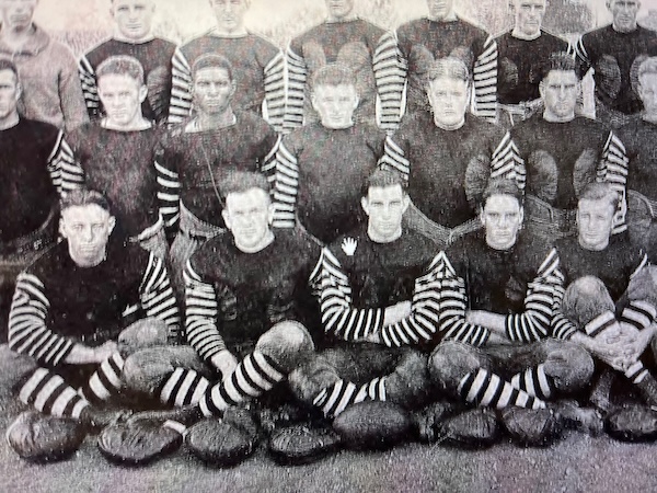 A team photo of football players, including Arthur James, from 1921.