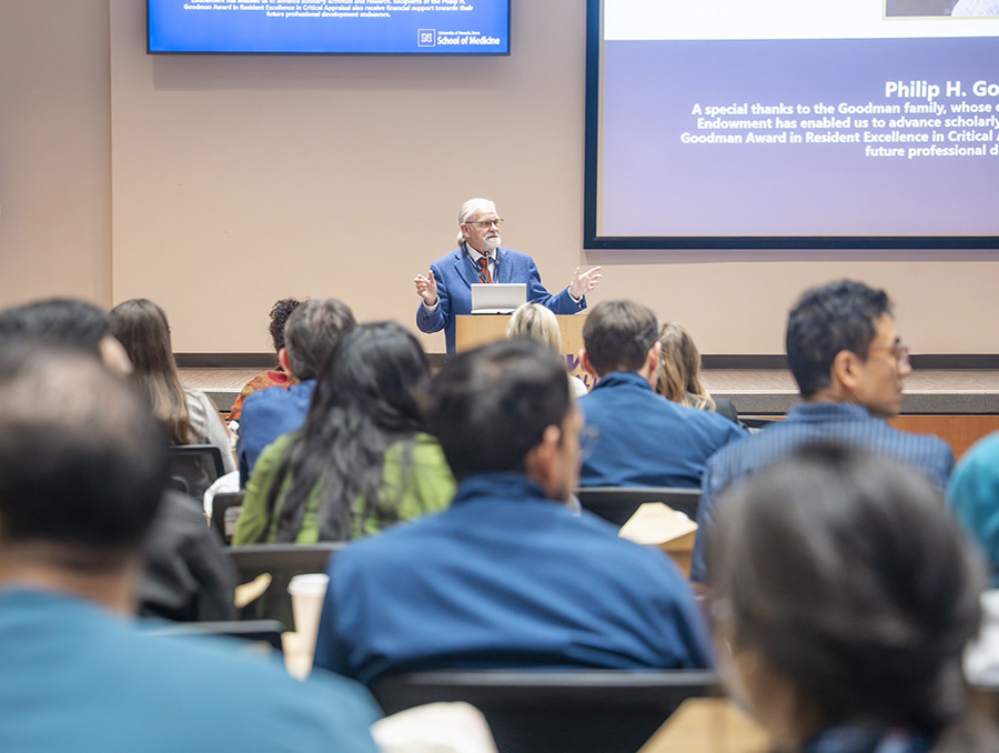 David Carlson, M.D., speaking to a full audience.
