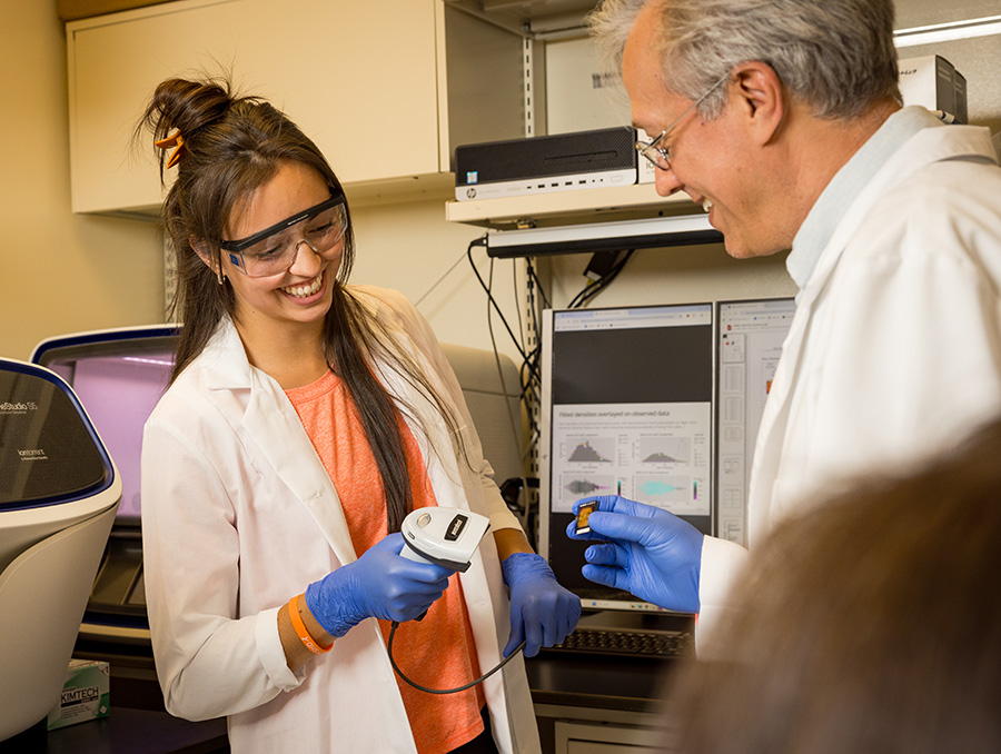 A technician in the Jones lab scanning a test.