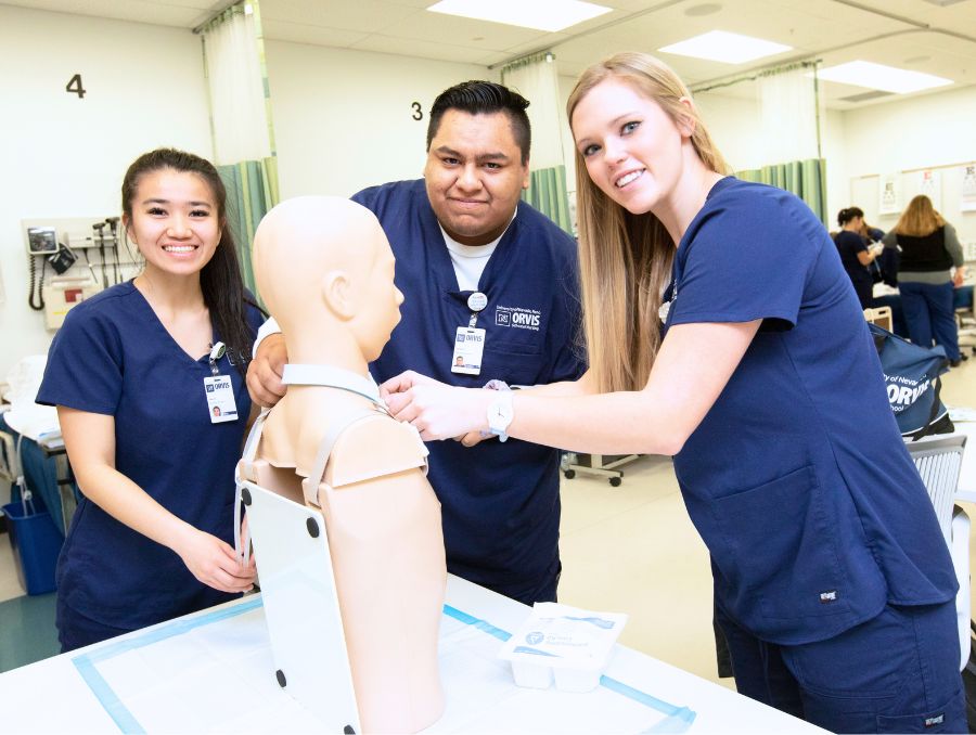 Nursing students with a patient simulator.