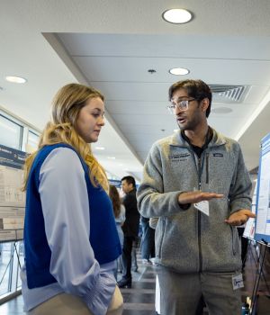 Two students at the pediatric symposium during the research poster competition