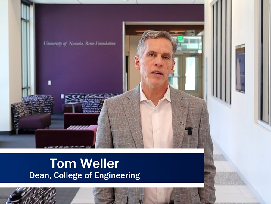 Clip from a video of Tom Weller standing in a hallway with the words "Tom Weller, Dean of Engineering" superimposed on the image. 